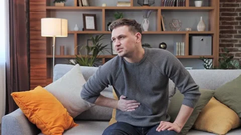 Man feels bad digestive problems abdominal pain illness suffers from liver pain. Video stock 172393141