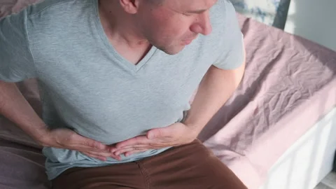 Man feels bad digestive problems, abdominal pain, stomach illness, belly ache Stock Footage 236640210