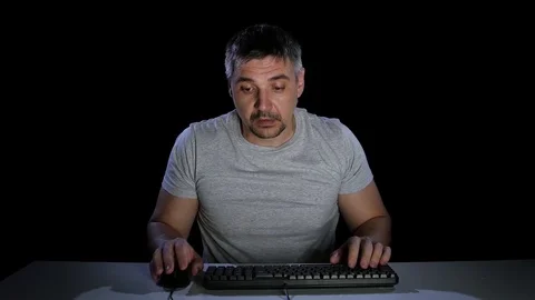 Man feels the emotions of perplexity communicating on the internet Stock Footage 70097745