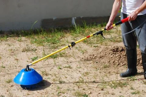 Man fertilizing the soil Stock Photos