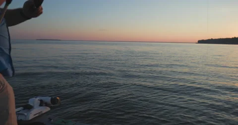 Man Fighting a Big Fish During Sunrise On Lake Livingston TX Video stock 215536405