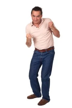 Man in fighting pose ready to punch Stock Photos