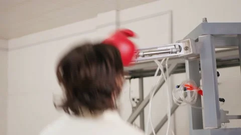 Man fights, trains with mechanical robot boxer. Gloved hand. new technologies Stock Footage 204970606