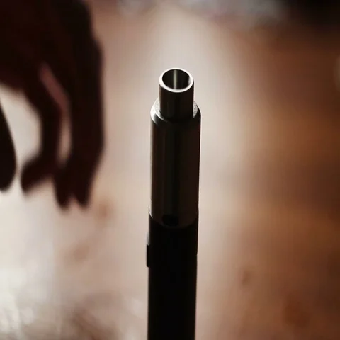 Man filling an electronic cigarette with e-juice. Man detaching the reservoir Stock Footage 69445600