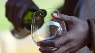 Man Filling Glass With Red Wine Stock Footage