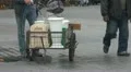 Man filling up his containers with fresh water HD Footage