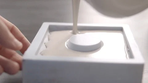 Man fills the mold with liquid solution Stock-Footage 130043170