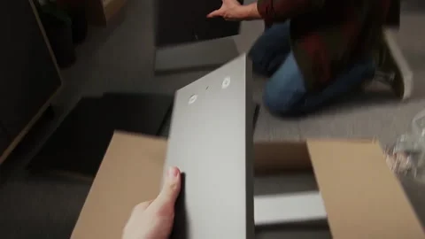 Man Filming Assembly of Flatpack Drawer with Partner on Camcorder Stock Footage 330522563