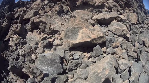 Man filming huge rocks while climbing them Stock Footage 72180142