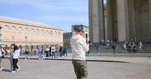 Man filming the Pantheon with a 360 camera in Paris, France Video stock 332109936