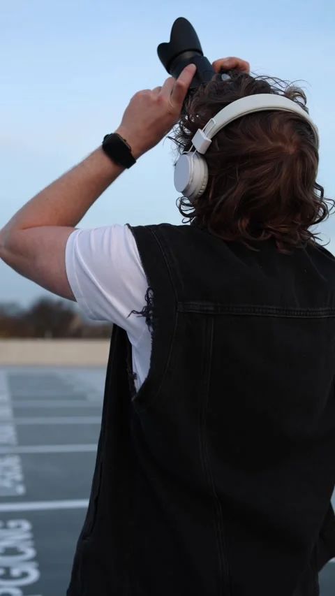 Man filming sky from behind Stock Footage 332116797