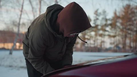 Man Finally Opens Car Bonnet After Struggling in Cold Urban Environment Stock Footage 310185994