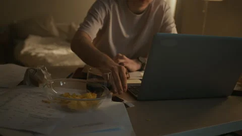 Man Finding Photo of Ex-Girlfriend while Writing Notes at Bedroom Desk Stock Footage 330662880