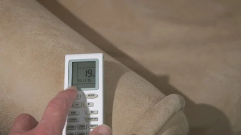 Man finger change conditioner temperature Stock Footage 333243078