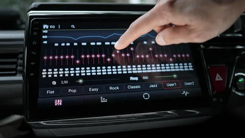 Man finger changing car audio equalizer settings using smart multimedia Stock Footage 160545048