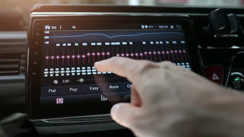 Man finger changing car audio equalizer settings using smart multimedia, modern Stock Footage 168878099