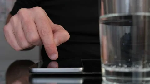 Man finger controlling smartphone on a table. Video stock 146010605