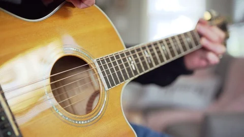 Man Finger picking Guitar Stock Footage 129478638