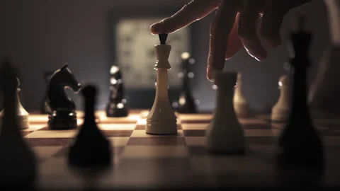 The man finger point white king on the board and then take off it from the board Stock Footage 312813315