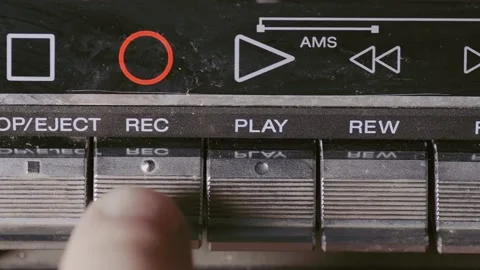 Man finger pressing some buttons on an old retro vintage cassette tape player Stock Footage 131091359