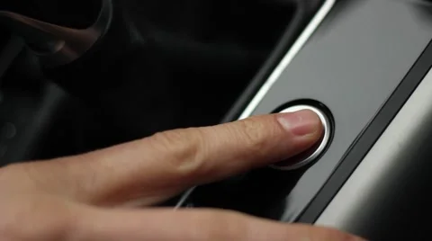 Man finger pushes start button in the car Stock Footage 47330356