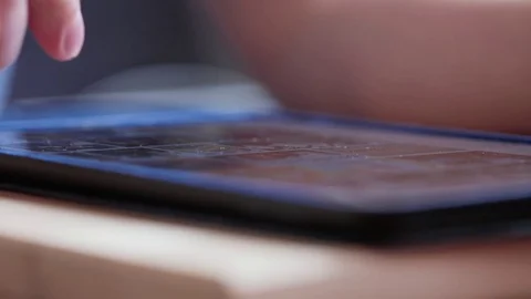 Man finger scroll page app on tablet. Browsing movie video in library to watch Stock Footage 80004937