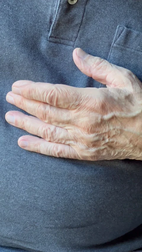 Man with finger tremor vertical Stock Footage 247663587