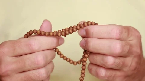 Man fingering the beads Stock Footage 75048871