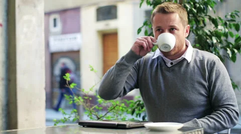 Man finish drinking coffee locking laptop and going away, steadycam shot. Stock Footage 36717095