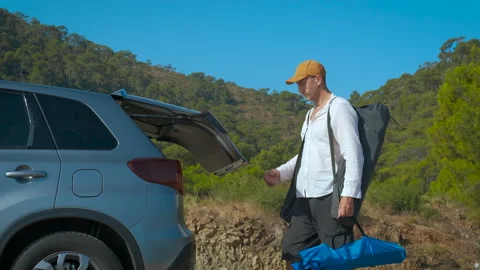 Man finished picnic by car. Stock Footage 285453960