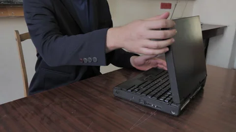 Man Finished Work On Old Retro Laptop Video stock 283658232