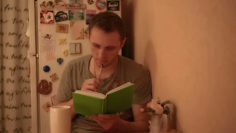 The man finished writing and thought Stock Footage 82186100
