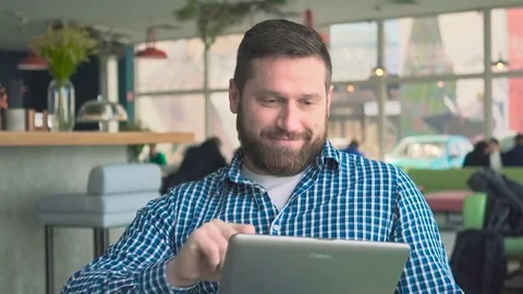Man finishes browsing tablet, drink coffee relax, in cafe, portrait, steadicam Vídeo Stock 72947586