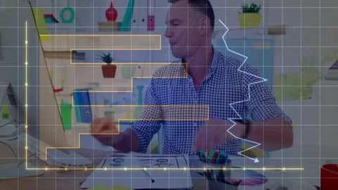 Man finishing notes moving to keyboard showing grid and chart overlay over Stock Footage 333317849