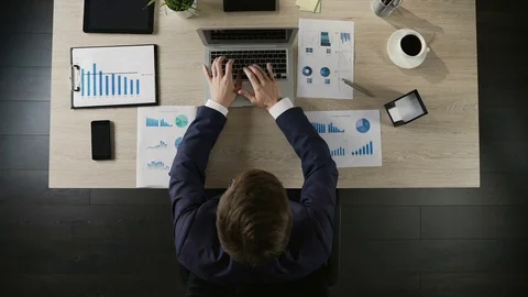 Man finishing project and closing laptop computer at workplace, top view Stock Footage