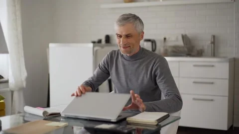 Man finishing work and thinking at home Stock Footage 133529414