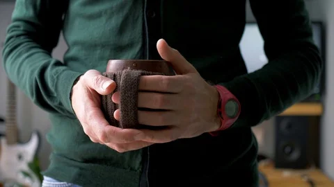 A man finishing work at a remote workplace. A freelance person who has a coffee Stock Footage 129995351