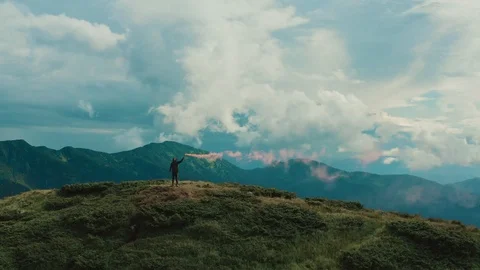 The man with a fire bomb standing on the beautiful mountain top Stock-Footage 116059092