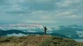 The man with a fire bomb standing on the mountain top 4k or 4k+ Resolution