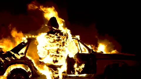 Man On Fire. The Burning Driver. Car Explosion. Stuntman. Slow Motion Video stock 87558483