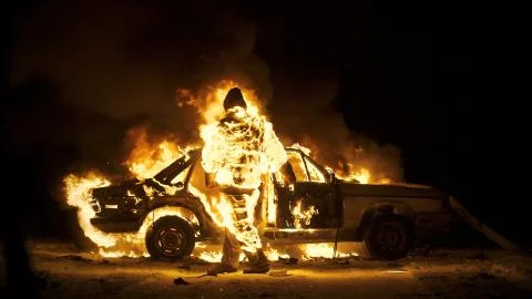 Man On Fire. The Burning Driver. Car Explosion. Stuntman. Stock Photos