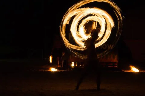 Man Fire Show on the beach Stock Photos