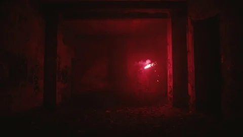 Man with fire walks through the catacombs Stock-Footage 129906009
