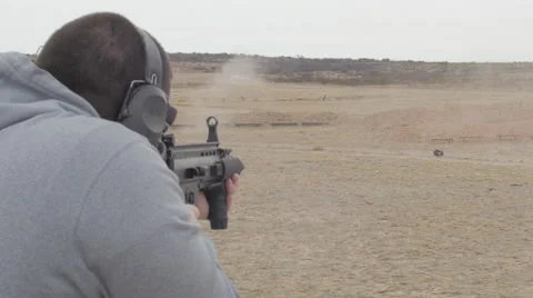 Man Firing Assault Rifle at Multiple Targets Stock Footage 60706932