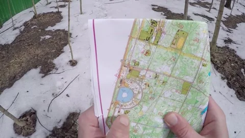 Man (first person view) look at map and show Stock Footage 299653605