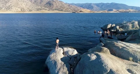 Man Fishing and Raising Drink at Lake Isabella in Kernville Stock Footage