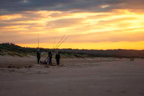 The man fishing at the beach Stock Photos
