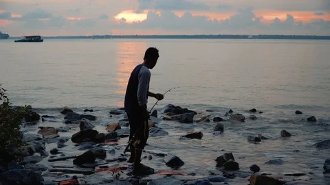 A man fishing at beach side. Video stock 99795835