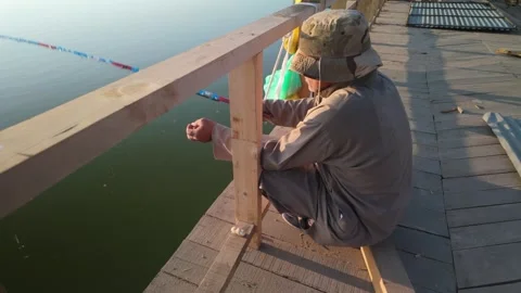 A man fishing in the the dal lake srinagar in the evening time Stock Footage 300706053