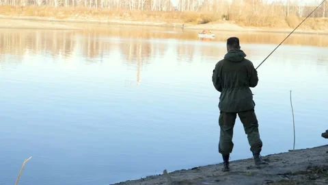 The man is fishing. Stock Footage 97343239